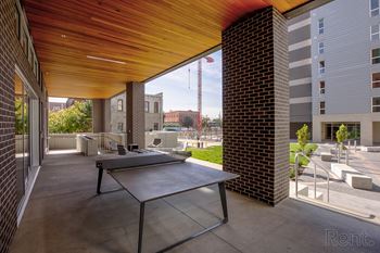A patio with a table and chairs is shown.